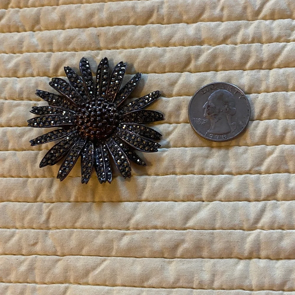 Antique sterling silver marcasite sunflower brooch.